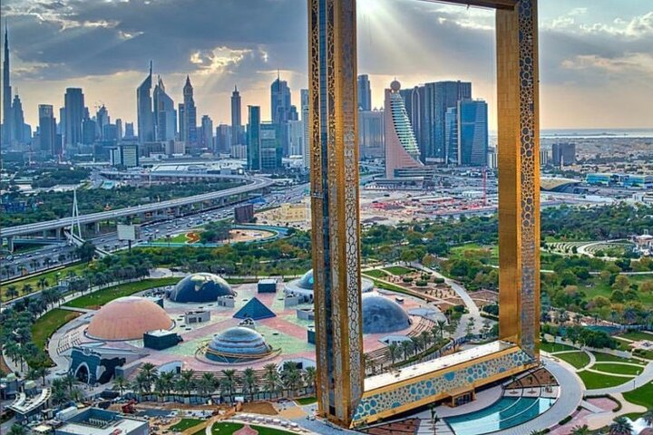 Experience stunning views of Dubai's skyline at the Dubai Frame where the harmony of old and new unfolds before your eyes creating a memorable journey in the city.